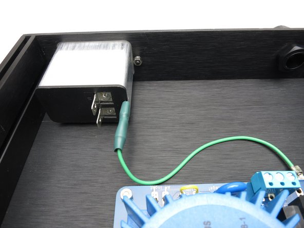 Connect an earth ground wire (Preferred color: Green or Green/Yellow) from IEC ground connection to chassis.  This can be direct to a hole in the chassis or to the power supply &quot;Chassis ground&quot; points on the power supply PCB.  Be sure to scrape away paint or anodization to expose bare chassis metal, and use a star or split lock washer.