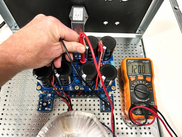 Set a DMM to measure AC voltage at an appropriate range (in this demonstration approximately 10VAC to 130VAC)