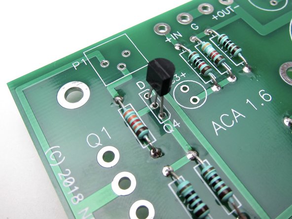 Align the flat of the small transistors with the silkscreen as shown.