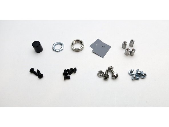 Top Row L to R - Power button, potentiometer nut, Headphone jack nut, Heatsink insulators (2), chassis standoffs (4)