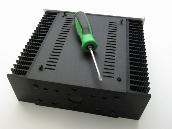 Sheet metal screws attach the top and bottom panels