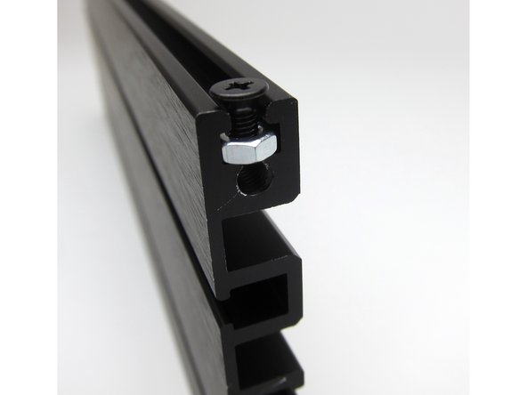 Top and bottom panels attach with screws and nuts in the rails as shown.