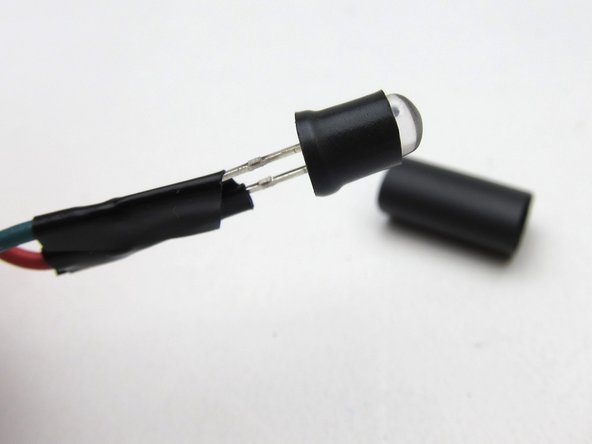 We have discovered there can be quite some variability in the thickness (and malleability) of the heatshrink used between batches. Use 1 or 2 layers as you feel works best for you.