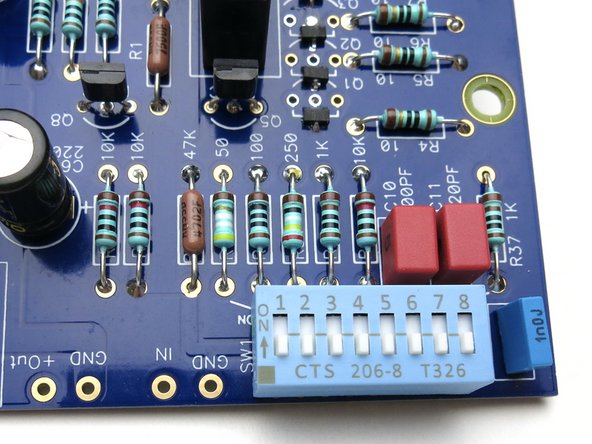 Orient as shown.  Move switch towards resistors/caps to turn ON.