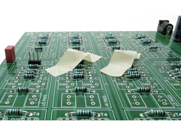 Photo 2 - The will fall out of the PCB if you don't secure them in somehow, it's easiest to use a little tape as shown.