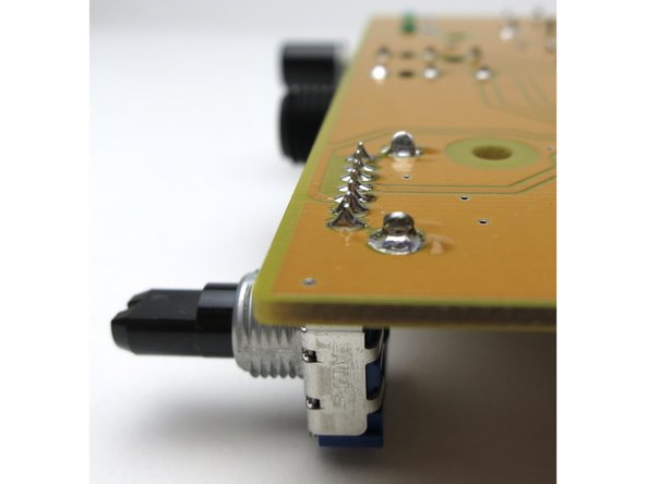The potentiometer have a row of pins, which are the electrical contacts, and the two bigger tabs, which are supports.