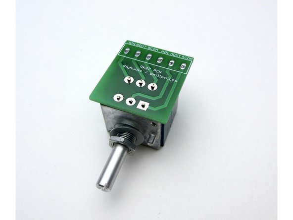 Photo 3 - A little tape helps keep everything in place when soldering the PCB.