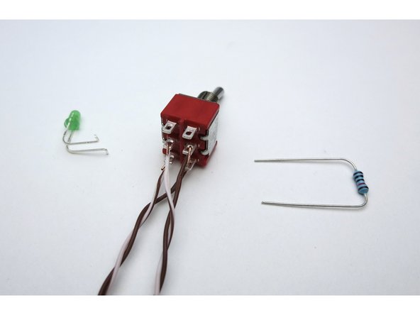 LED and resistor as shown. Making a couple of bends where the LED attaches to the switch will greatly aid assembly.