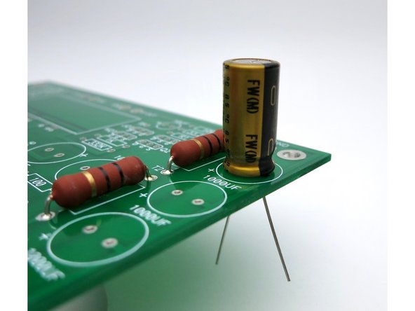 Photo 3 - Bend the leads out a little to keep the components in the PCB before soldering.