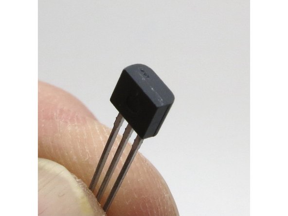 The slightly larger and smoother small-signal transistor is the ZTX450 N-channel BJT (Bipolar Junction Transistor)