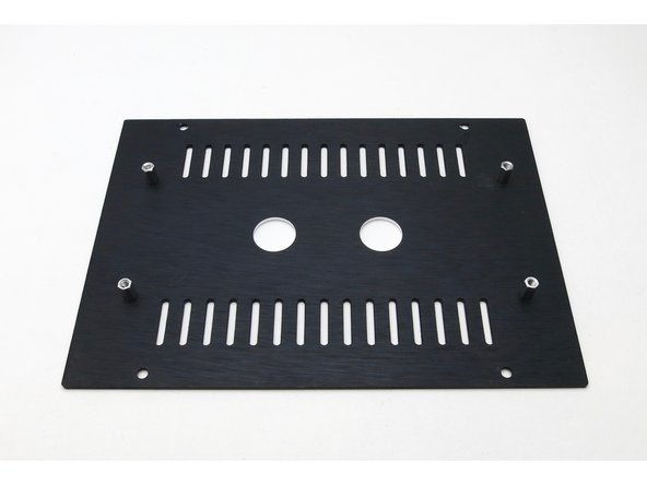 Attach the standoffs to the top plate with the black countersunk screws.