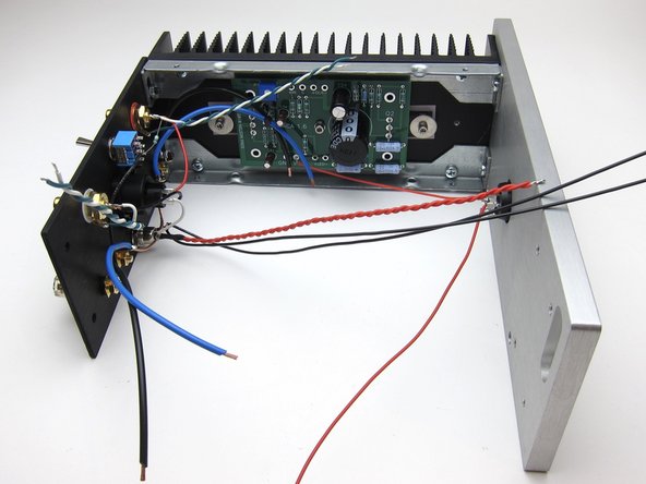Mechanically, start with one of the PCB/heatsink assemblies and attach to the front panel. Then secure the back panel to the same heatsink assembly.