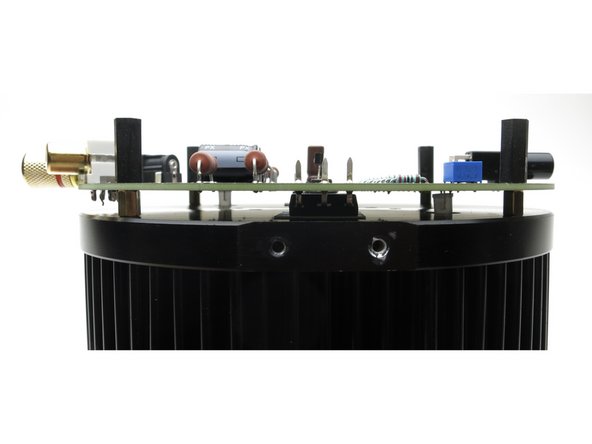 ...gently wiggle the PCB and get the mounting holes over the brass standoffs,