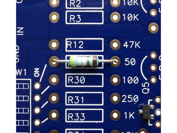 Photo 2 - Striped resistors, thick brown band to the right. The thick brown is the 5th digit, I.E., in this orientation they read L to R.