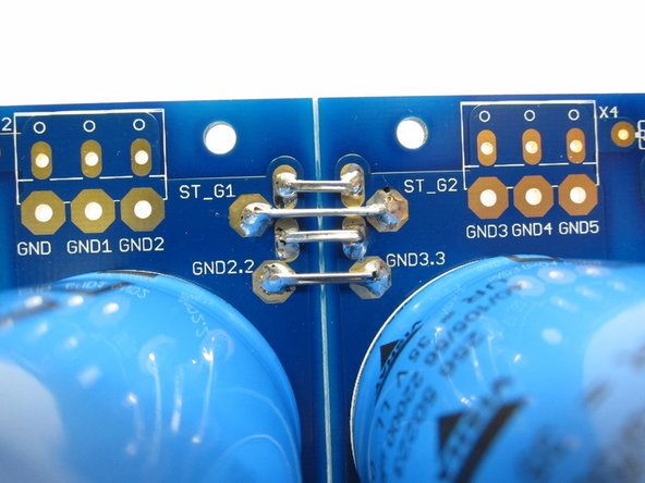 Photo 1) Please connect the two sides of the ground as shown - it won't work properly without it. Use a few wires or lead cut-offs, to insure a solid, quiet, and low-impedance ground.