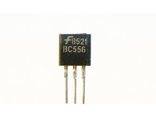 Using any appropriate magnification, separate the transistors. Key markings are J74, B556, and 385B12