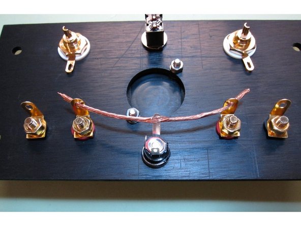 Take some of the heavier wire included in the kit and cut a length as shown in the picture. Strip off the insulation so the wire is bare.