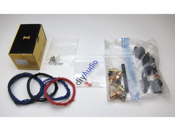 Parts kit includes 24v power adaptor, wire, LEDs (red and blue), standoffs, RCAs and XLRs, wire, and more.