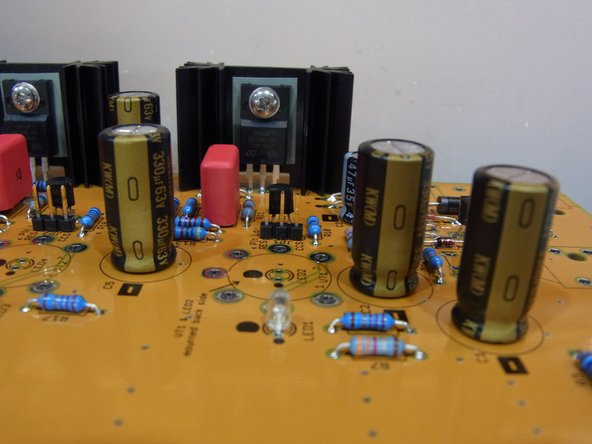 The Negative side of the can-style capacitors are marked on the can itself.