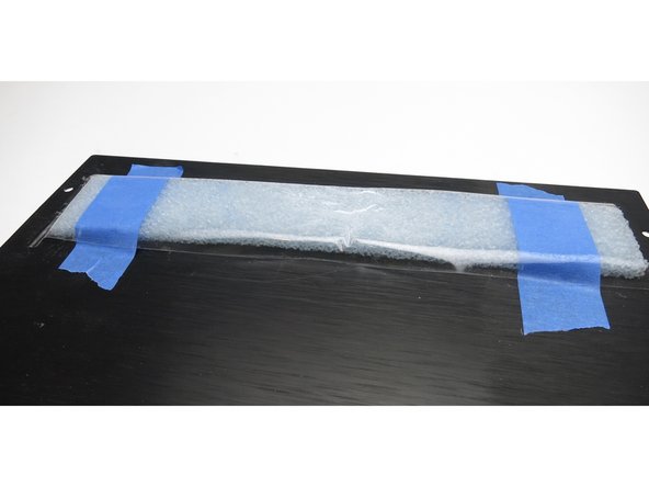 Photo 2 - This is just some closed-cell shipping foam taped to the inside of the vents. Both it and the sticky foil-backed material worked well. Blocking it seems to be more important than absorbing or damping.