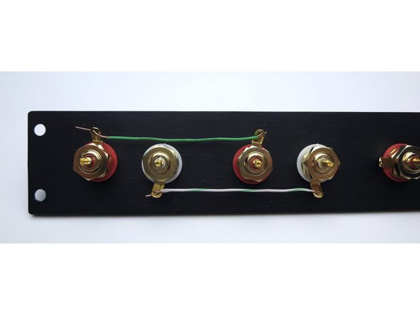 Photo 1 - Ground tabs tied together as shown. Solid green to right ground tabs, white/grn to left tabs.