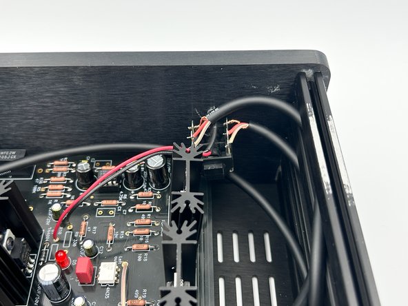 Ensure that you have the M3 nuts inserted into the side rails for attaching the top panel.