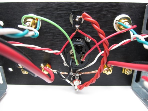 Output is taken from the black speaker posts