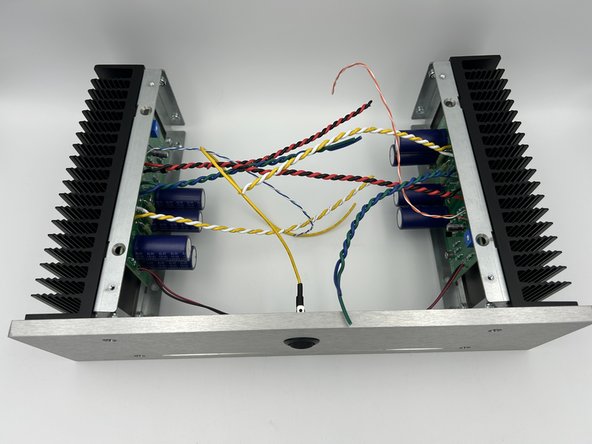 Install the front panel to the heatsinks using your choice of black or stainless M4 x 12 bolts and M4 Lock Nuts.  Do not fully tighten.