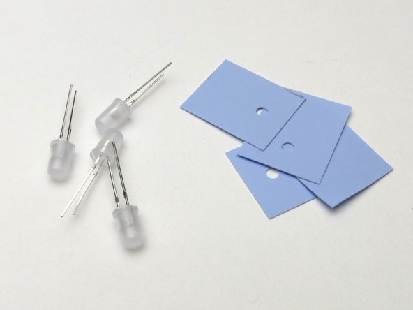 The blue insulator pads go in-between the power transistors and heatsink.