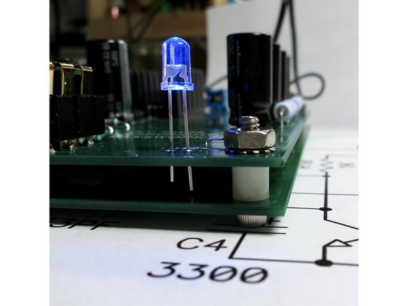 Screw from bottom, spacer in-between, nut on top.