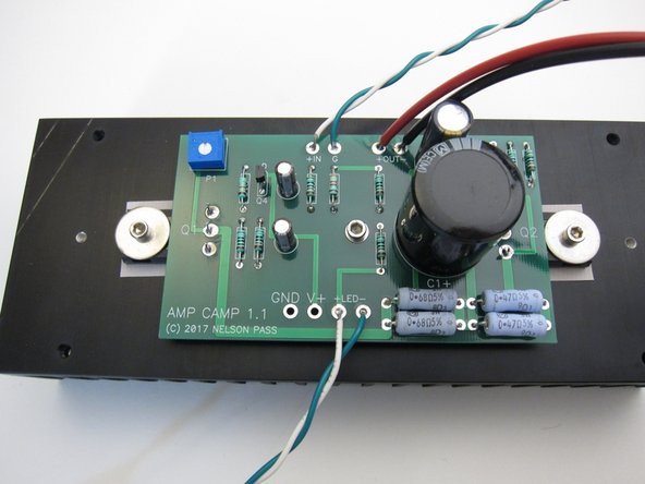 The LEDs are routed forward and placed in the front panel hole - the wire stiffness will keep them in place, particularly if you make the wire a little longer than necessary.