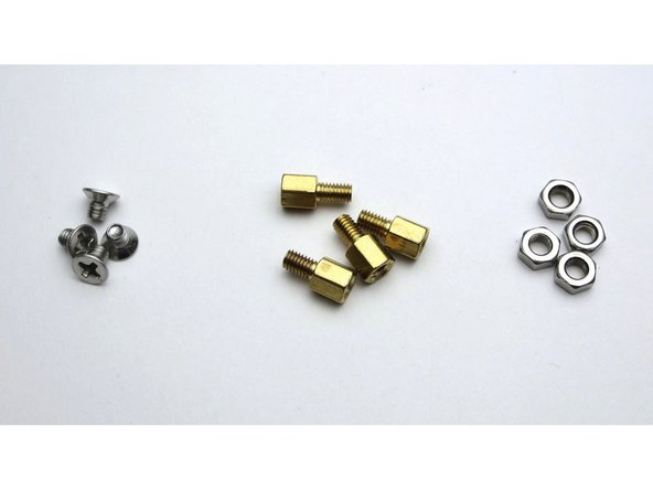 The standoffs attach to the inside of the bottom panel.