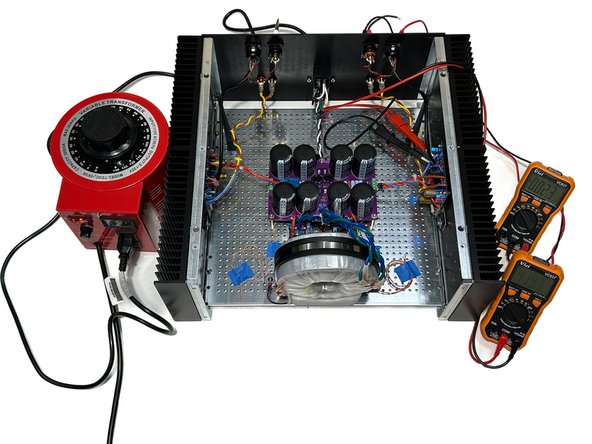 Turn on the amplifier power switch, and turn on the variable transformer.  You should see close to 0V or &lt;100mV on both DMMs.  If you see anything above 100mV.  STOP! 