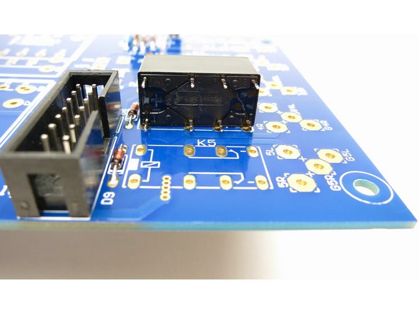 Photo 1 - The relays can only be installed one way.   Ensure all pins line up.  If any pins are bent, realign them to match the holes in the PCB.