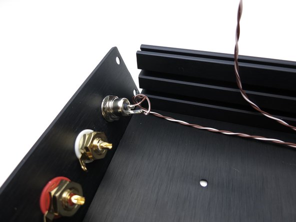 Photo 1 - Wires to middle of front panel power switch. Brown is barrel center, white/brn is tab (photo 3).