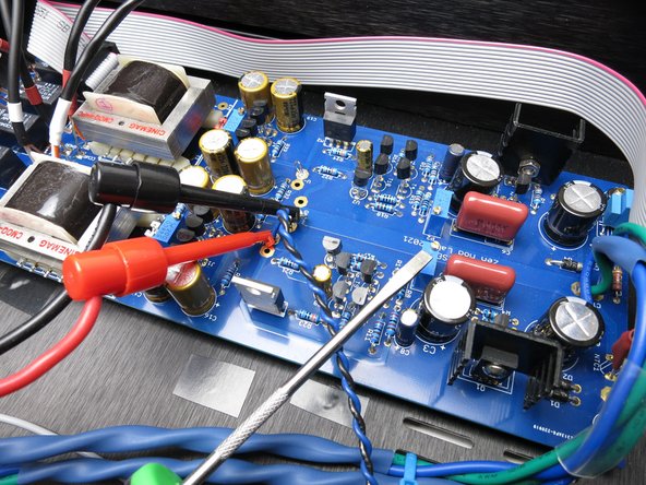Photo 2 - As per the diagram in the previous step, meter as shown for V+, and adjust the pot the screwdriver is pointing to.