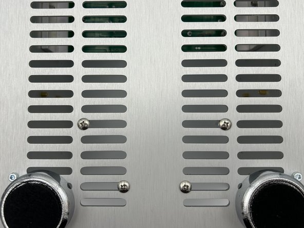 Loosely mount the standoffs to the bottom panel as shown in photo 1.