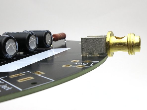 Align the holes in the binding post to be vertical when installed.