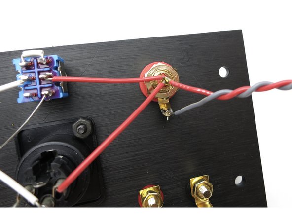 Photo 2 - Solder twisted pair grey/white wire, long enough to reach the PCB,  to white channel RCA. Solder now.