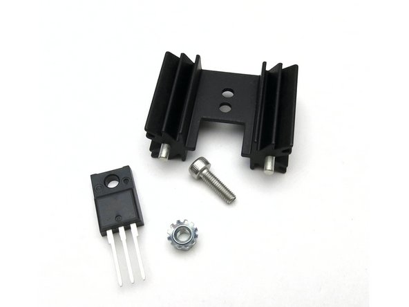 Mount regulators to heatsinks with screw and kepnut.  See Photo 2.