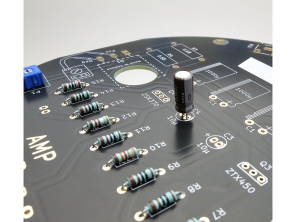 The 10uF caps can be installed and soldered at this time. Remember, long leg in the + hole.