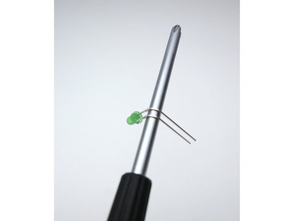 Bend the LED 90deg around the curve of a screwdriver. Long leg on top.