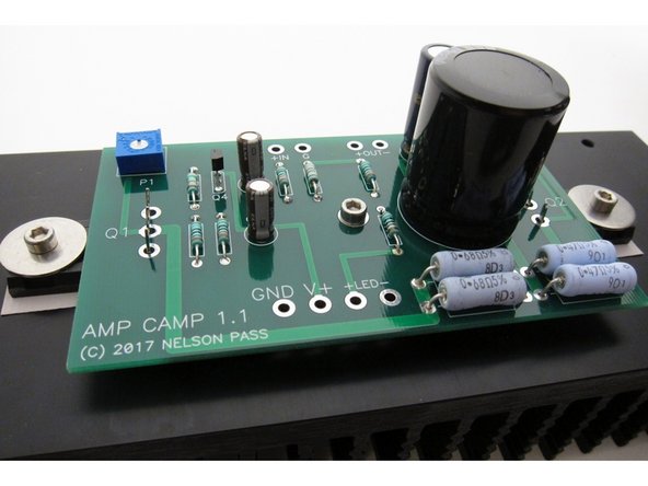 One screw and washer to hold the PCB to the center standoff, and align the big transistor legs with the holes.