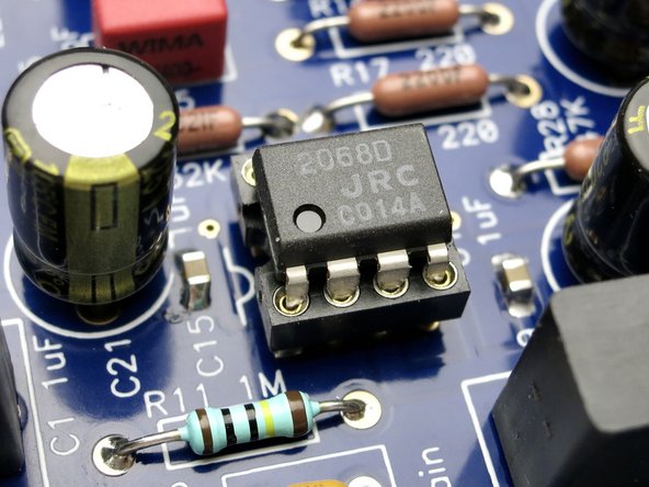 DIP socket notch lines up as shown on silkscreen. Pin 1 of the op amp is designated by the dot.