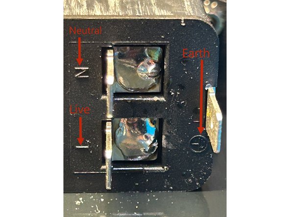 Using the larger black, flat head screws included with the chassis, securely fasten the back panel to the side panels.