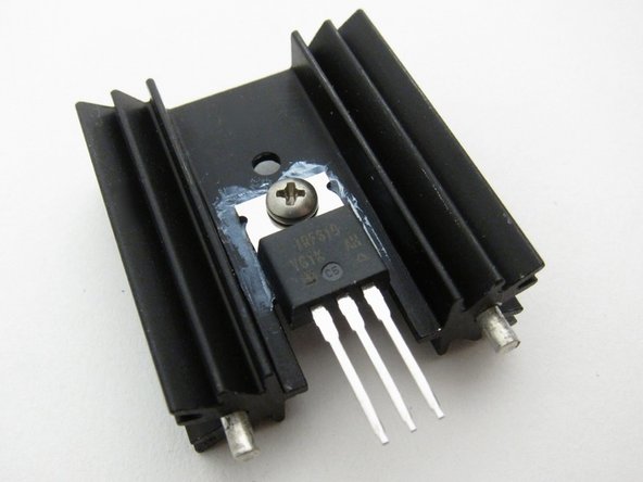 The heatsinks are not attached electrically to the PCB, you do not need to use insulators if your TO-220 devices have metal tabs. A bit of thermal grease is extremely helpful.  Align the device to he heatsink and snug on the screw, but do not make it tight yet.