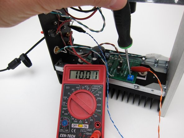 Set your meter to DC volts, use the 20vdc range if your meter is not auto-ranging. If using 24v PSU, set meter to 200vdc.