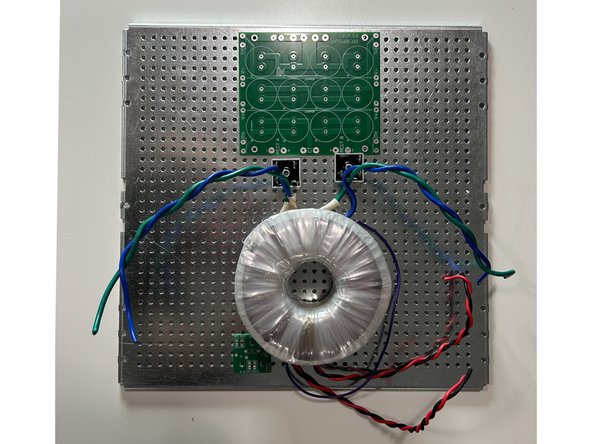 Gather the perforated base plate, the power supply PCBs, the rectifiers, and your transformer. Begin to plan your chassis layout keeping in mind wire routing that may include, but is not limited to: