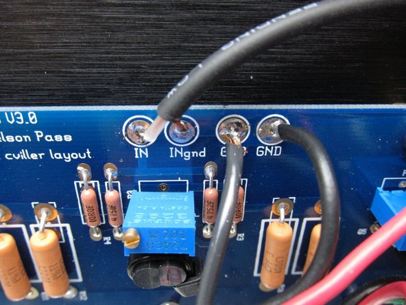 The PCB connections to GND are all tied together, but it's still nice to have individual holes for the wires. Input ground from the RCA jack, speaker, PSU.