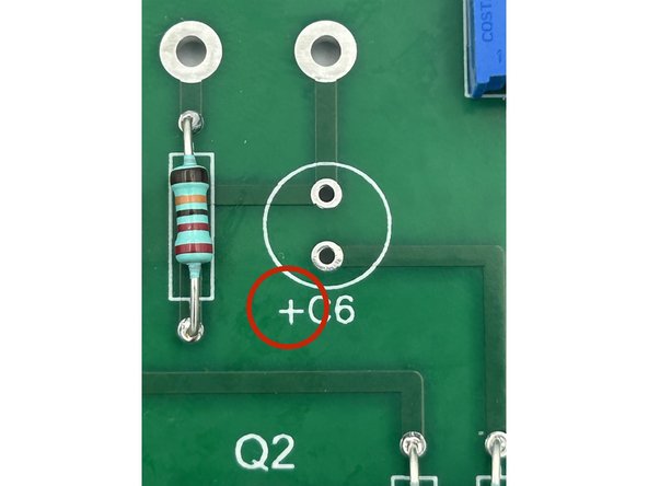 Pay attention to the cap orientation. The long leg is inserted closest to the pad with the (+) marking on the PCB.